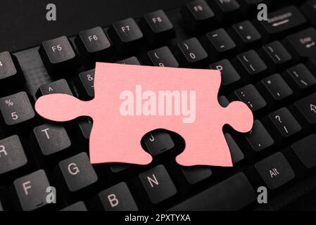 Colored sticker lying on keyboard. Important message written over paper. Stock Photo