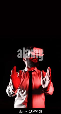 Man Wearing Vr Glasses And Presenting Important Messages Between Hands. Stock Photo
