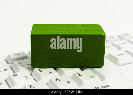 Colored cube with important message lying on keyboard. Main information. Stock Photo