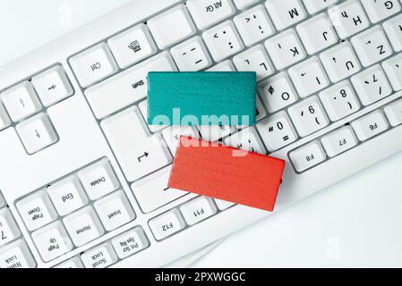 Colored cube with important message lying on keyboard. Main information. Stock Photo