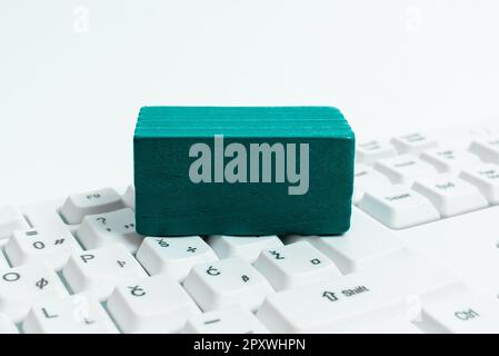 Colored cube with important message lying on keyboard. Main information. Stock Photo
