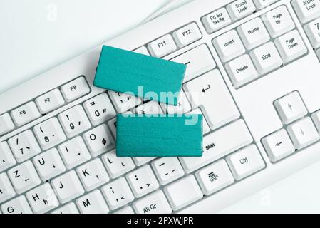 Colored cube with important message lying on keyboard. Main information. Stock Photo