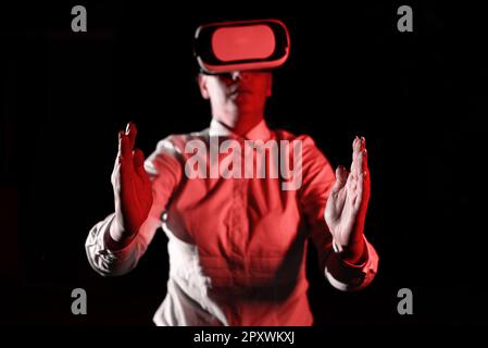 Woman Wearing Vr Glasses And Presenting Important Messages Over Both Hands. Stock Photo
