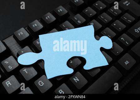 Sticker lying on black keyboard. Important message written over paper. Stock Photo