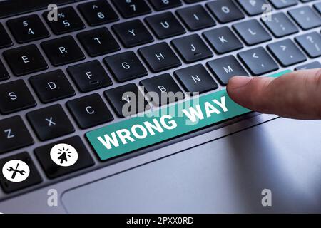 Text caption presenting Wrong Way, Word for taking an unsuitable or undesirable manners or direction Stock Photo