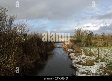 Leighton Beck flowing through  Arnside Moss Arnside Westmorland and Furness England Stock Photo