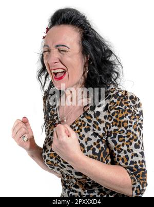 Angry woman in leopard dress screaming and clenching her fist Stock Photo