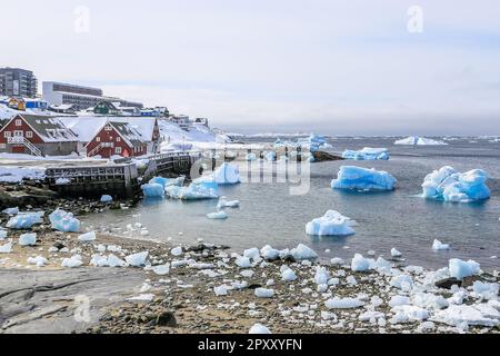 Nuuk old harbor panorama with blue icebergs drifting in the lagoon, Nuuk,, Greenland Stock Photo