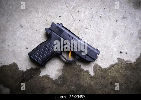 Old disused gun, criminality and death, delinquency Stock Photo