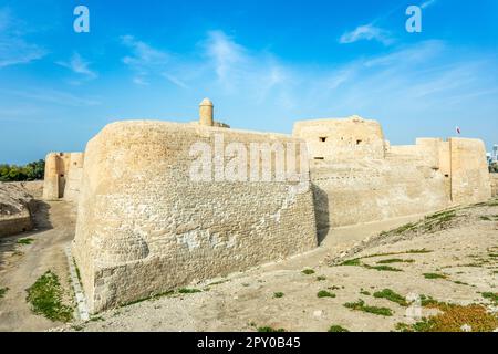 Walls and towers of Qalat al-Bahrain portuguese fortress, Manama, Bahrain Stock Photo