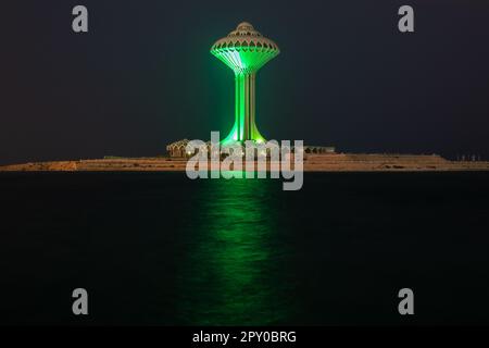 Al Khobar water tower illuminated in green during the night on the sea shore, Dammam, Saudi Arabia Stock Photo