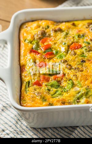 Homemade Savory Eggbake Breakfast with Spinach Sausage and Peppers Stock Photo
