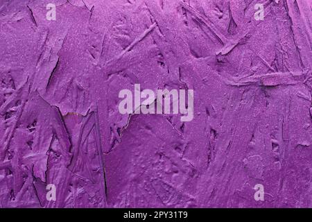 Concrete wall, Old flaky paint on surface, purple color, texture. Abstract background, copy space Stock Photo