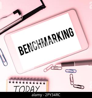 Sign displaying Benchmarking, Concept meaning Evaluate something by ...