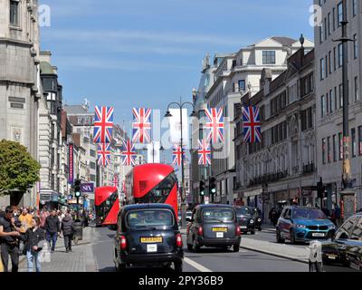 Banners and flags in Strand Street to celebrate the coronation of the King Charles III on the 6th of May Stock Photo