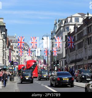 Banners and flags in Strand Street to celebrate the coronation of the King Charles III on the 6th of May Stock Photo