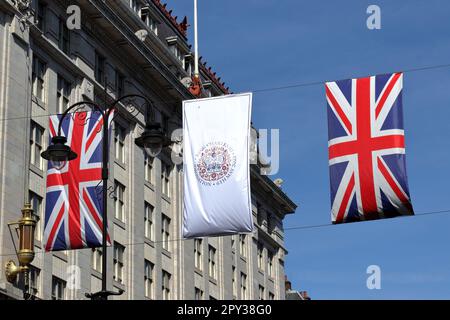 Banners and flags in Strand Street to celebrate the coronation of the King Charles III on the 6th of May Stock Photo