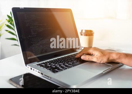 Web application development. programmer woman writing program code sitting at workplace in office, software developer hands coding HTML programming wi Stock Photo