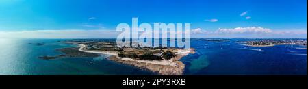 Aerial view of the Pointe de Kerpenhir at the entrance of the Gulf of Morbihan in Brittany, France - Panoramic view of the rocky peninsula at low tide Stock Photo