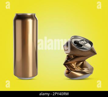 Whole and crumpled aluminum cans on yellow background Stock Photo