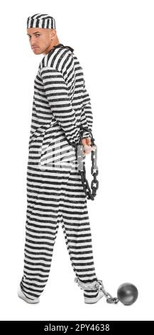 Prisoner in striped uniform with chained hands and metal ball on white background Stock Photo