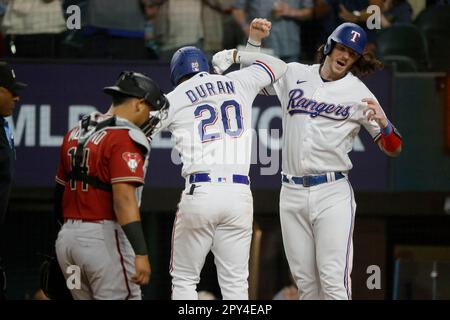 Texas Rangers' Ezequiel Duran, left, is caught stealing second base by  Toronto Blue Jays shortstop Bo Bichette (11) during the eighth inning of a  baseball game in Arlington, Texas, Saturday, June 17