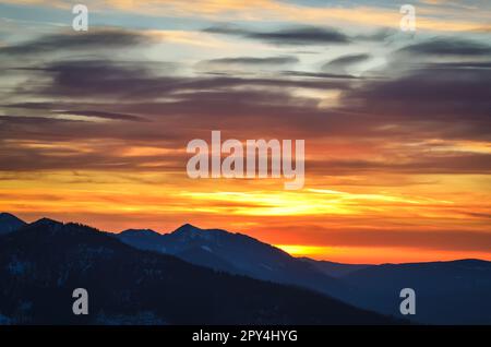 Beautiful mountain theme to use for example as a background. Colorful sunset over the peaks in the Polish Tatra Mountains. Stock Photo