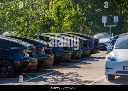 Mölndal, Sweden - May 26 2022: New black Tesla Model Y electric cars almost ready to be delivered. Stock Photo