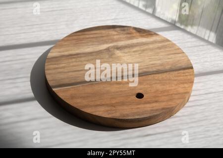 photo wooden cutting board on a light table Stock Photo