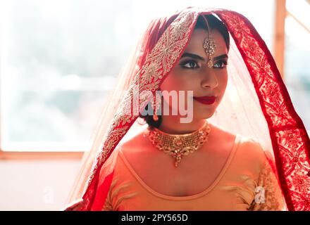 Makeup, jewellery, outfit...everything is perfect. a beautiful young woman getting ready for her wedding. Stock Photo