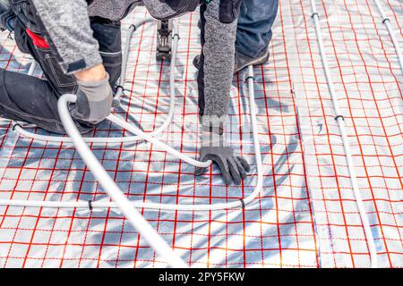 installation of underfloor heating in a new building Stock Photo