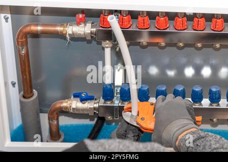 connecting the floor heating to the switchboard Stock Photo