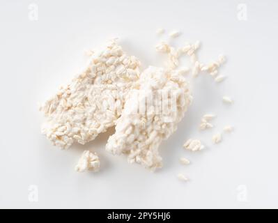 Rice malt placed against a white background. Koji mold. Stock Photo