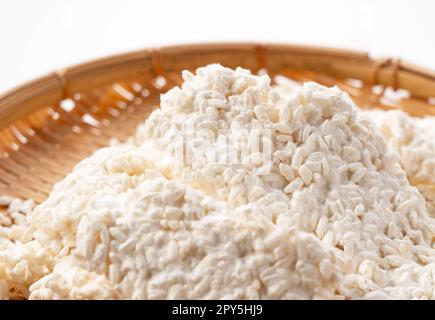 Rice malt placed against a white background. Koji mold. Stock Photo