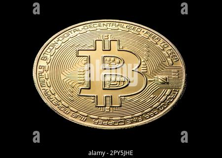 gold coin bitcoin on a black isolated background Stock Photo