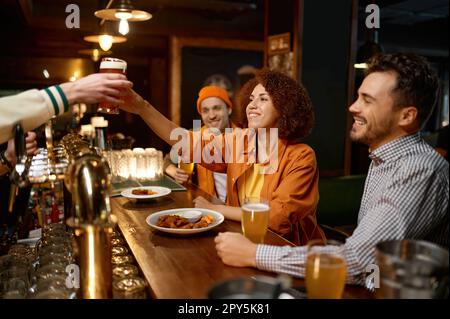 Happy friends company rest in sports bar together Stock Photo