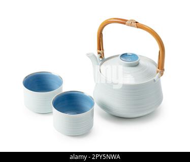 Japanese teacups and teapots placed against a white background. Stock Photo