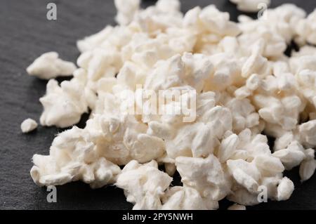 Close-up of rice koji placed on black background. Koji. Stock Photo