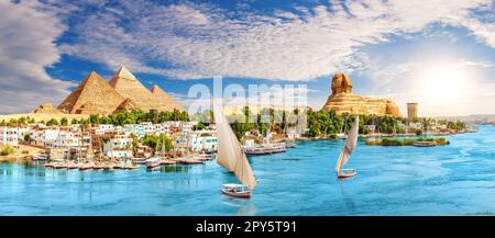 Skyline panorama of Aswan city on the way to the Great Sphinx and Pyramids of Egypt Stock Photo