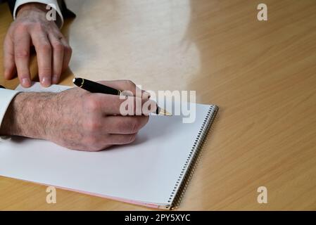 Ballpoint pen on white sheet of paper Stock Photo