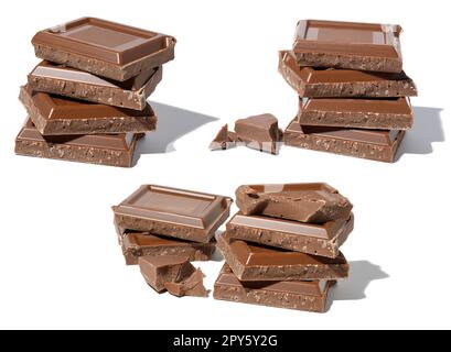 A stack of broken milk chocolate on a white isolated background, square pieces Stock Photo