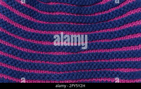 Texture of a knitted blue fabric. Detail of clothing Stock Photo