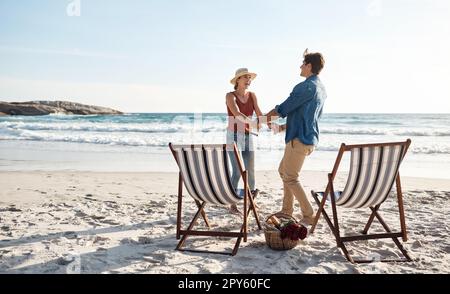 Were exactly where were supposed to be. a middle aged couple dancing on the beach. Stock Photo