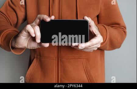 Smartphone in male hands Stock Photo