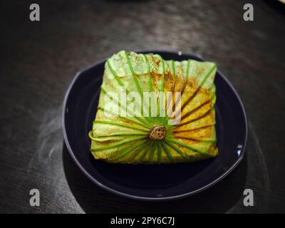 Rice Wrapped in Lotus Leaves . Thai food . Stock Photo