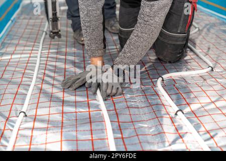 installation of new underfloor heating Stock Photo