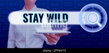 Sign displaying Stay Wild. Concept meaning keep being you and