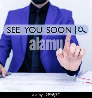 Writing displaying text See You Soon. Business approach used for saying goodbye to someone and going to meet again soon Stock Photo