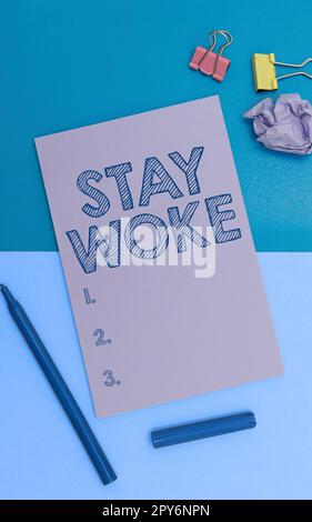 Text sign showing Stay Woke. Business overview being aware of your surroundings and things going on Keep informed Stock Photo