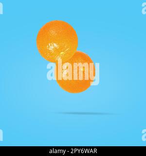 Tangerine fruit on creative colored background with clipping path as package design element Stock Photo
